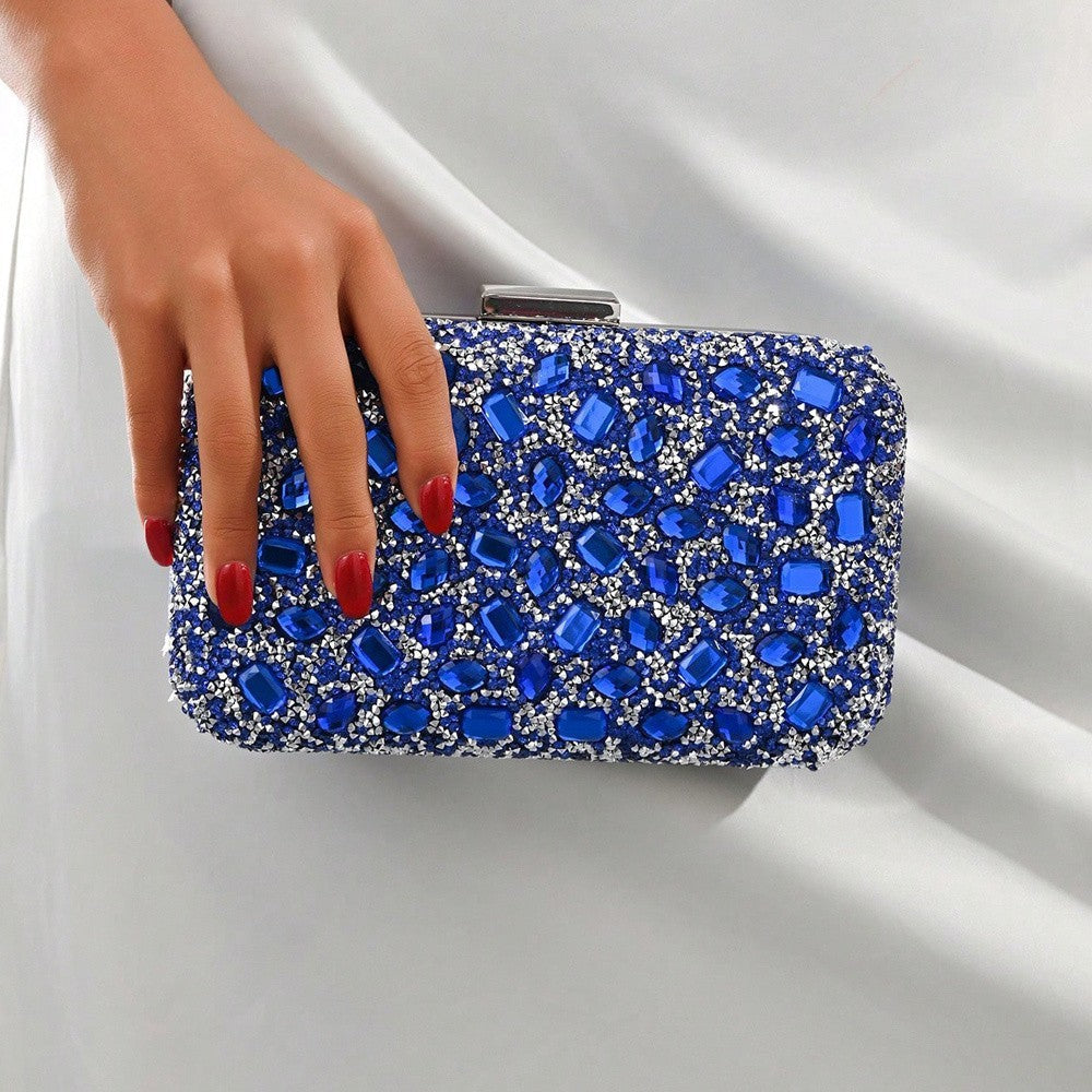 VALENORA Aurelina blue PU clutch bag covered in sparkling rhinestones with a silver buckle closure