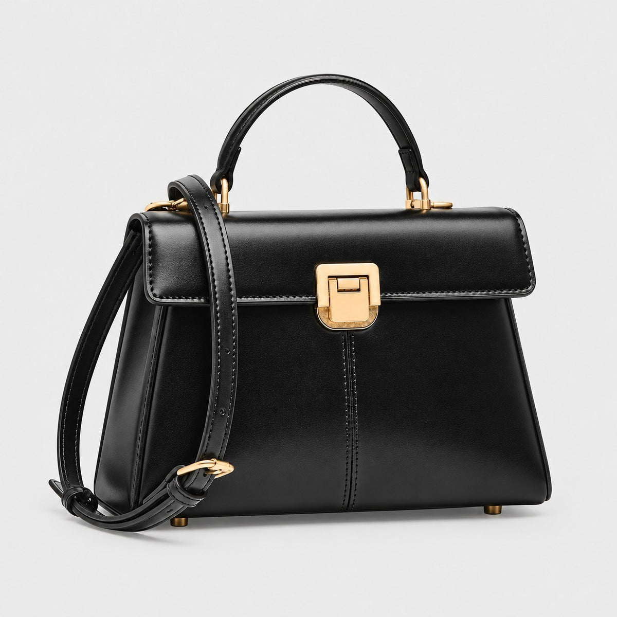 VALENORA Henna black genuine leather structured crossbody handbag with gold hardware and top handle.