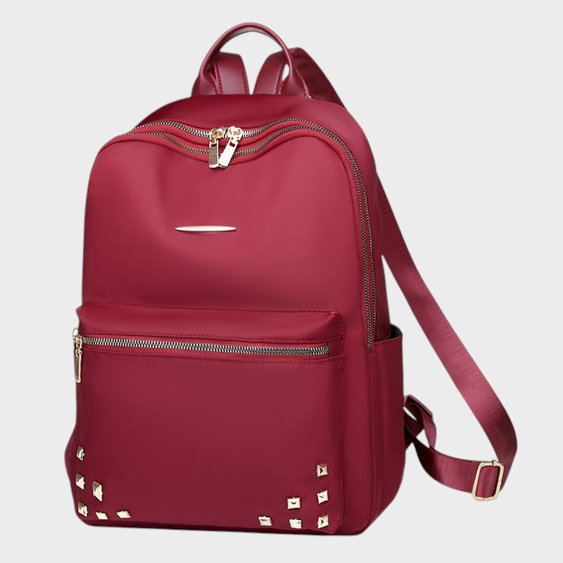 VALENORA Juno red oxford cloth travel backpack with gold stud accents and zippered compartments