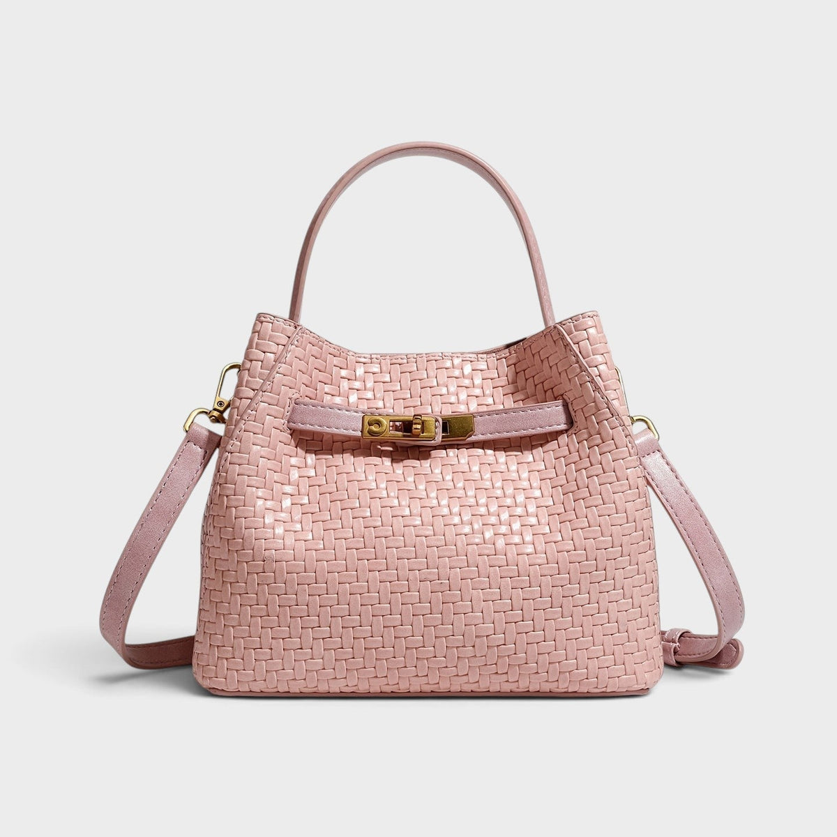 VALENORA Miranda pink woven leather shoulder bag with gold buckle hardware, top handle, and adjustable strap.