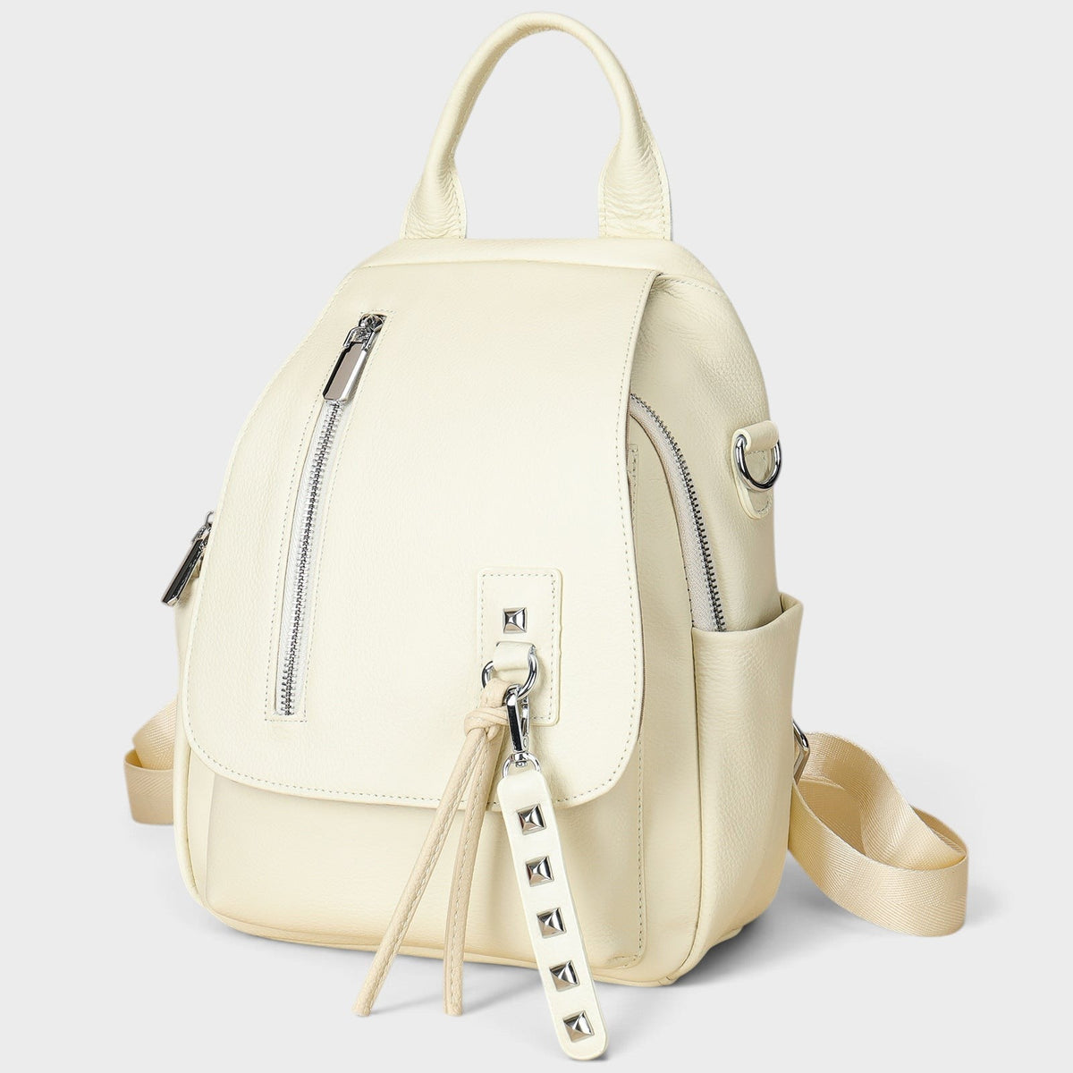VALENORA Wren white leather backpack with a front flap, silver hardware, and decorative studded tassel detail.
