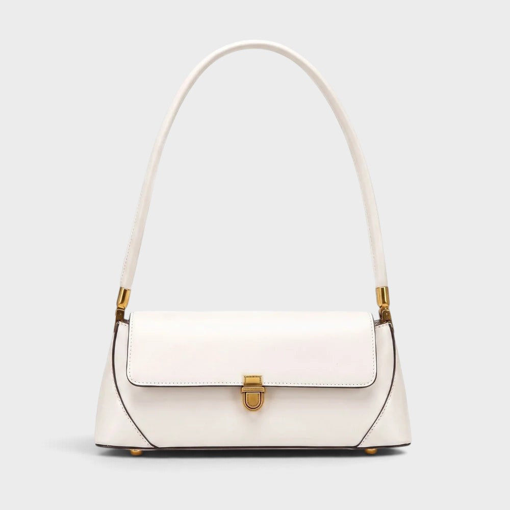 VALENORA Amancia white genuine leather baguette shoulder bag with gold-toned hardware and structured clasp closure.