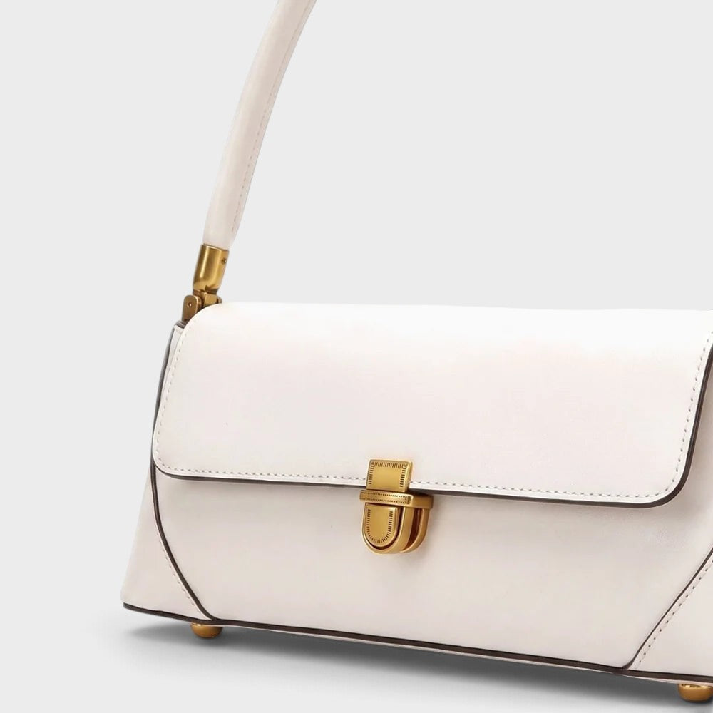 VALENORA Amancia white synthetic leather baguette shoulder bag with gold-toned clasp hardware and structured design.
