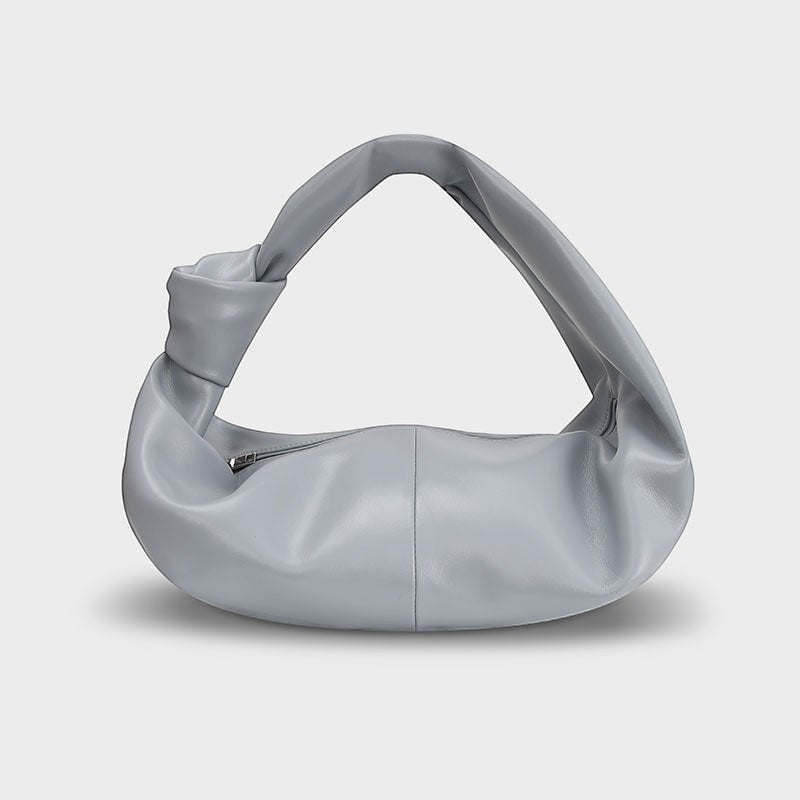 VALENORA Amanda handbag in cloudy blue vegan leather with a soft rounded silhouette and knotted shoulder strap.