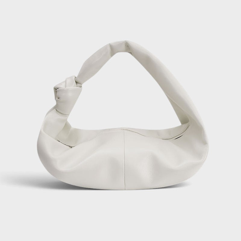 VALENORA Amanda milky white vegan leather handbag with a soft, rounded silhouette and a knotted shoulder strap.