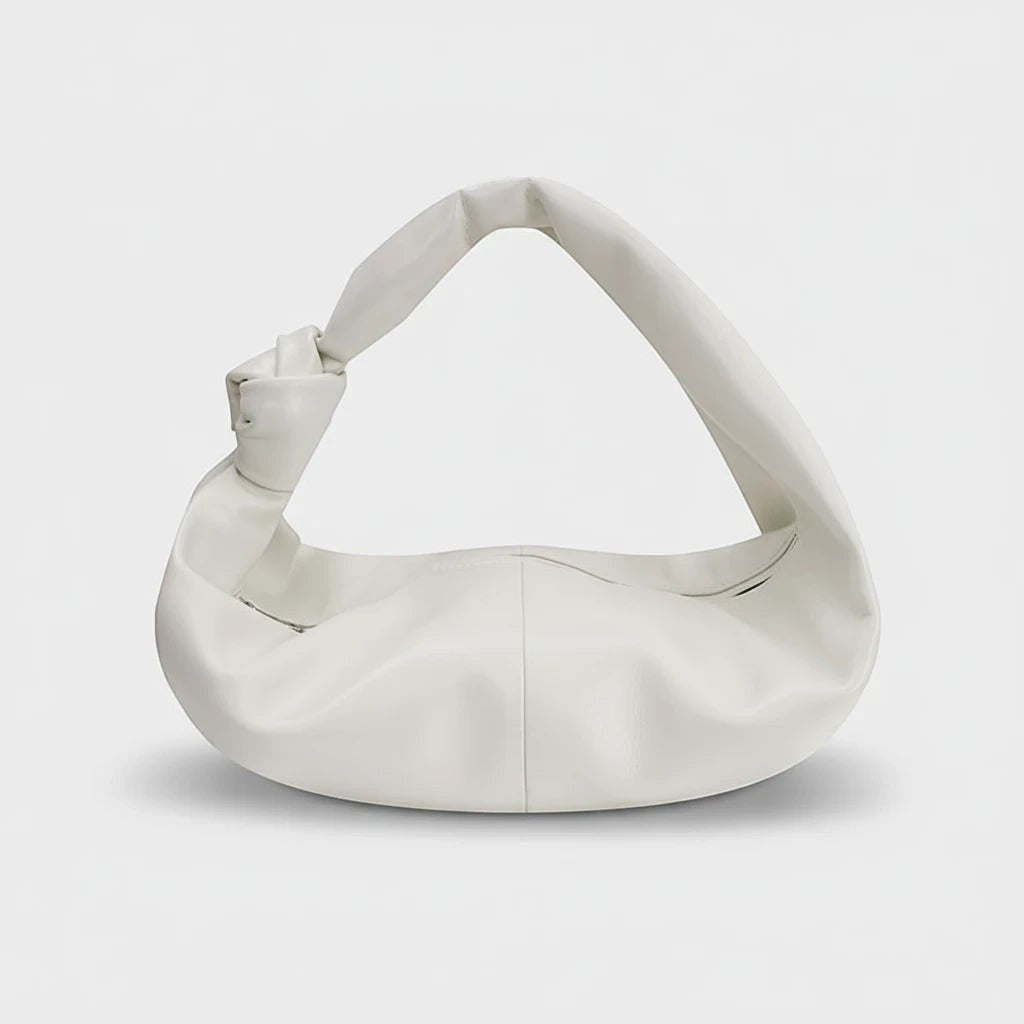 VALENORA Amanda milky white vegan leather handbag with a soft, rounded silhouette and a knotted shoulder strap.