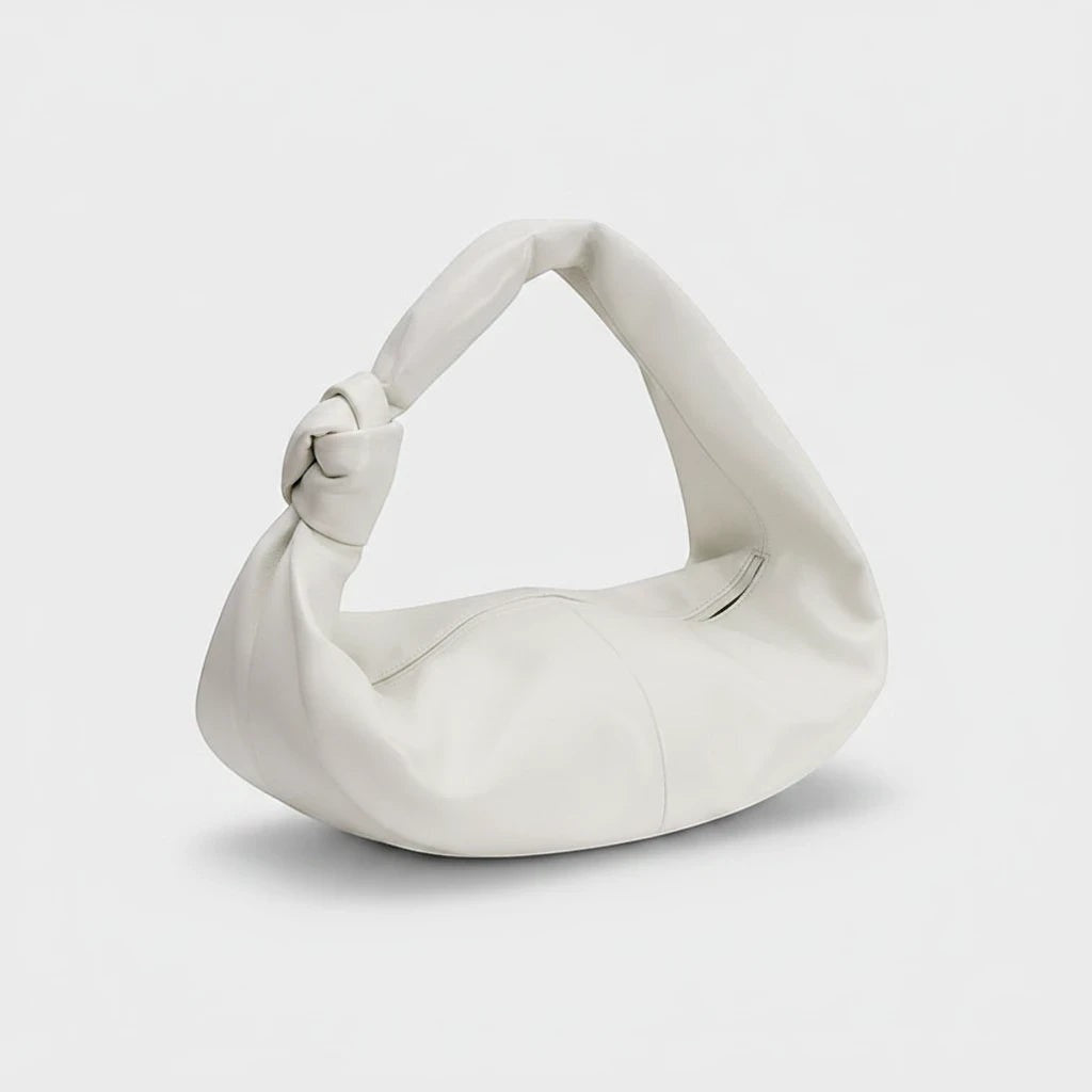 VALENORA Amanda milky white vegan leather handbag with a soft rounded silhouette and a knotted shoulder strap detail.