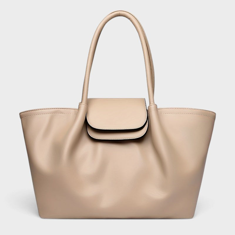 VALENORA Amara beige vegan leather tote bag with a structured boxy silhouette, dual shoulder straps, and front flap.