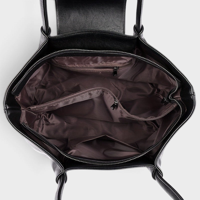 VALENORA Amara black vegan leather tote bag interior view showing zippered compartments and fabric lining