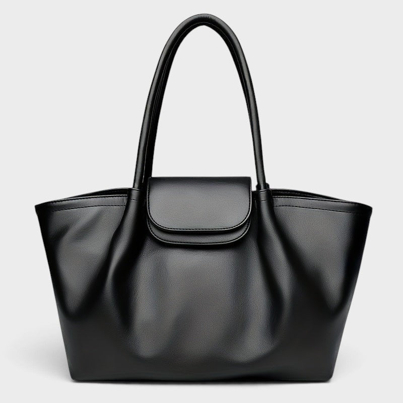 VALENORA Amara black vegan leather tote bag with a structured boxy silhouette, dual shoulder straps, and front flap.