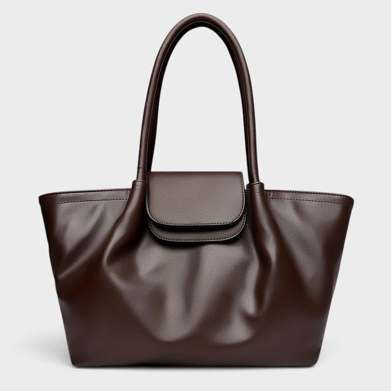 VALENORA Amara dark brown vegan leather tote bag with a structured boxy silhouette and front flap buckle closure.
