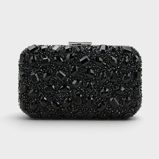 VALENORA Aurelina black clutch bag covered in sparkling rhinestones with a secure buckle closure for formal events.