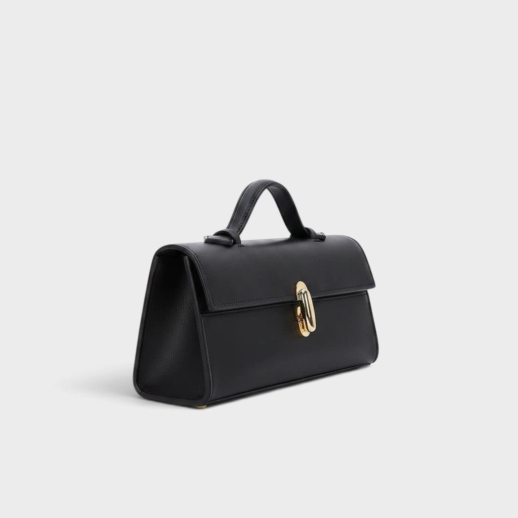 VALENORA Bella black genuine leather handbag with a structured boxy silhouette and polished gold metal clasp closure