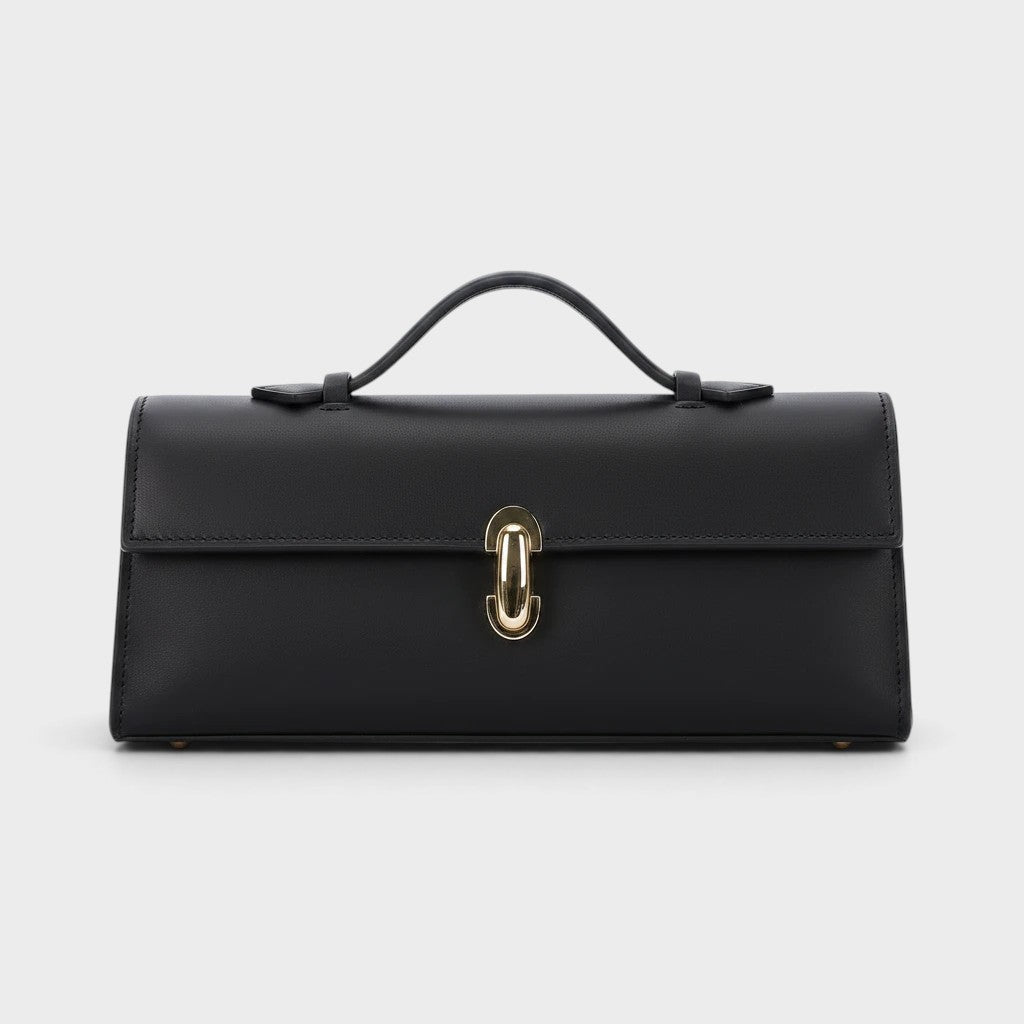 VALENORA Bella black genuine leather handbag with a structured boxy silhouette and polished gold metal clasp closure.