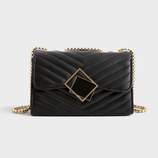 VALENORA black vegan leather crossbody bag with chevron quilting, gold chain strap, and square buckle detail.