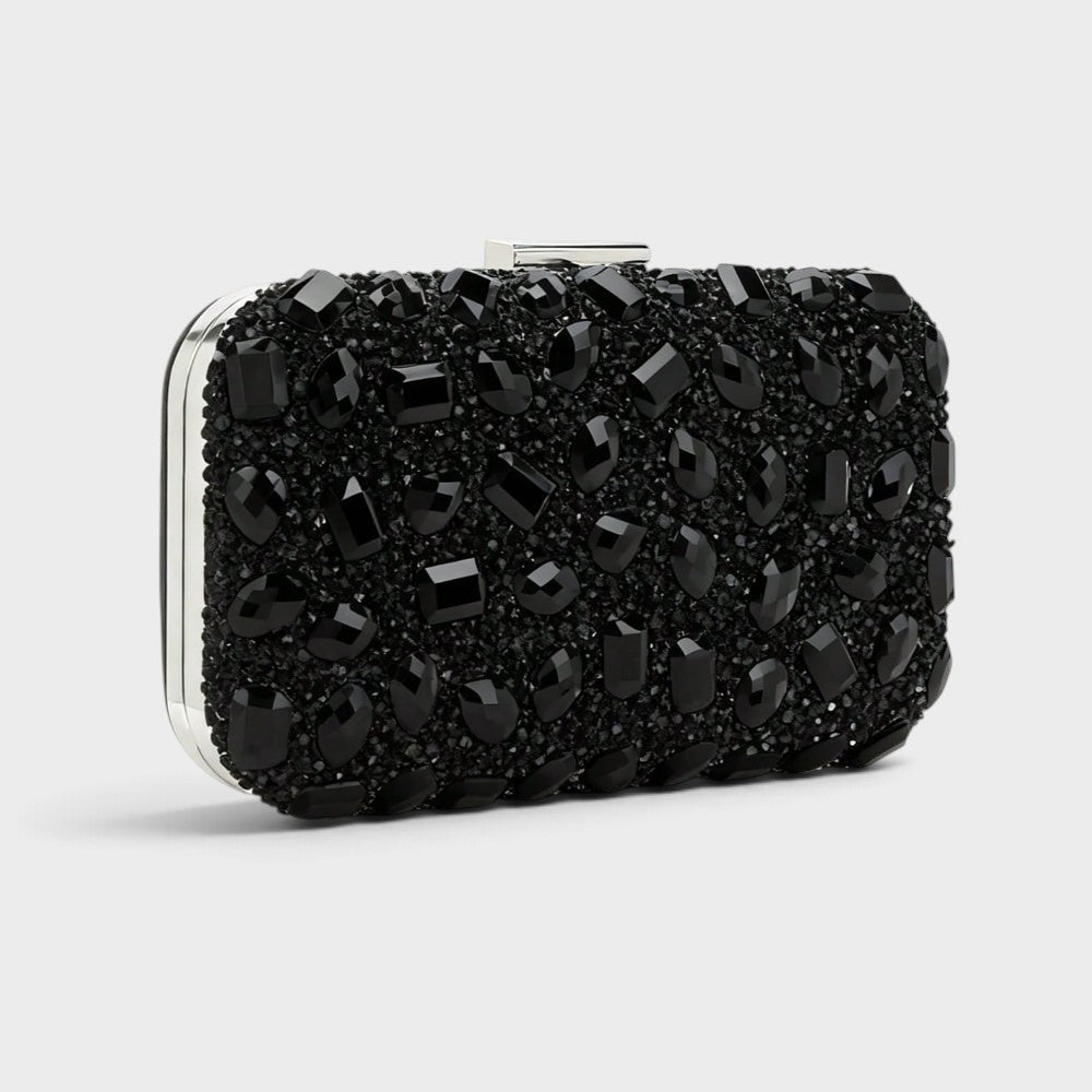 VALENORA Aurelina black clutch bag covered in sparkling rhinestones with a silver buckle closure for formal occasions