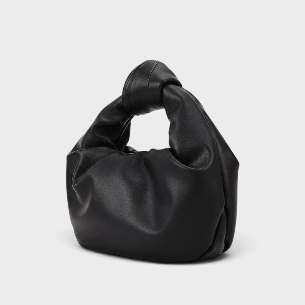 VALENORA black vegan leather handbag with a soft slouchy silhouette and a knotted top handle design.