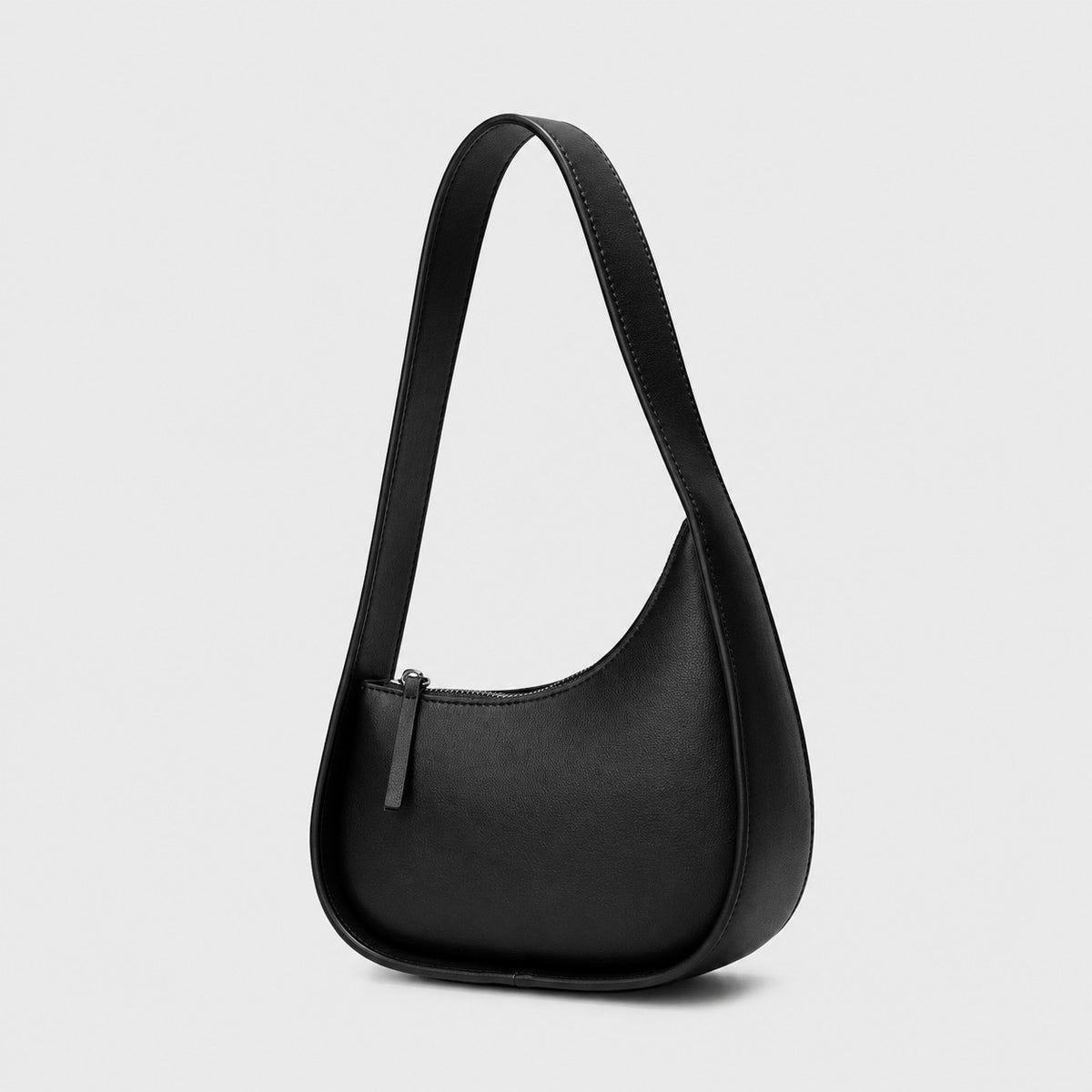 VALENORA Brooklyn black genuine leather crescent shoulder bag with a gold-tone zipper and wide comfortable strap.