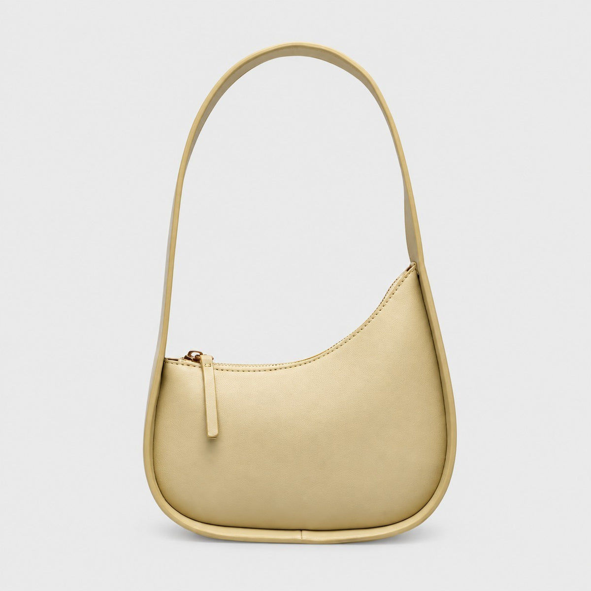 VALENORA Brooklyn shoulder bag in light yellow genuine leather with a curved crescent silhouette and gold zipper.
