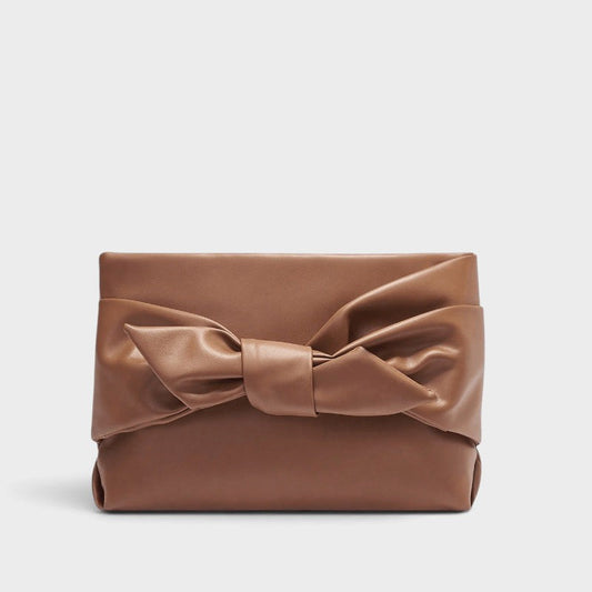 VALENORA brown leather handbag featuring a structured rectangular shape and a prominent decorative bow on the front.
