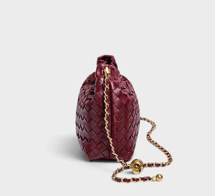 VALENORA Adele burgundy woven leather shoulder bag with a gold chain strap and gathered top, side view