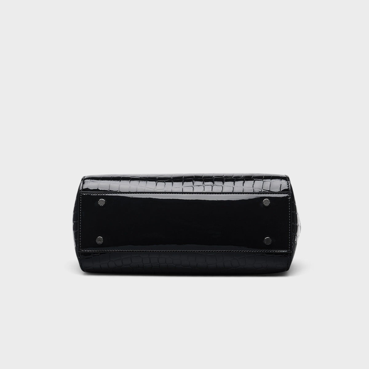 VALENORA Celeste black croc-embossed leather handbag base showing protective metal feet