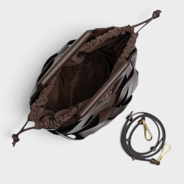 VALENORA Celia brown woven leather handbag with a drawstring closure and detachable shoulder strap, top view.