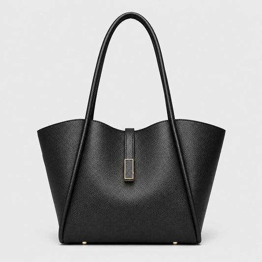 VALENORA Charlotte black vegan leather tote bag with litchi-grain texture, curved top edge, and gold hardware tab.
