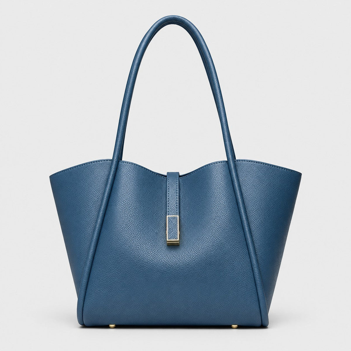 VALENORA Charlotte blue vegan leather tote bag with litchi-grain texture, curved top edge, and gold hardware tab.