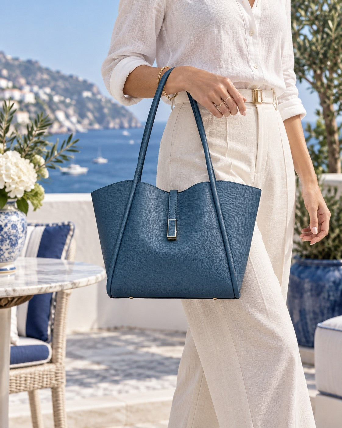 VALENORA Charlotte tote bag in blue litchi-grain vegan leather with a curved top and gold hardware tab