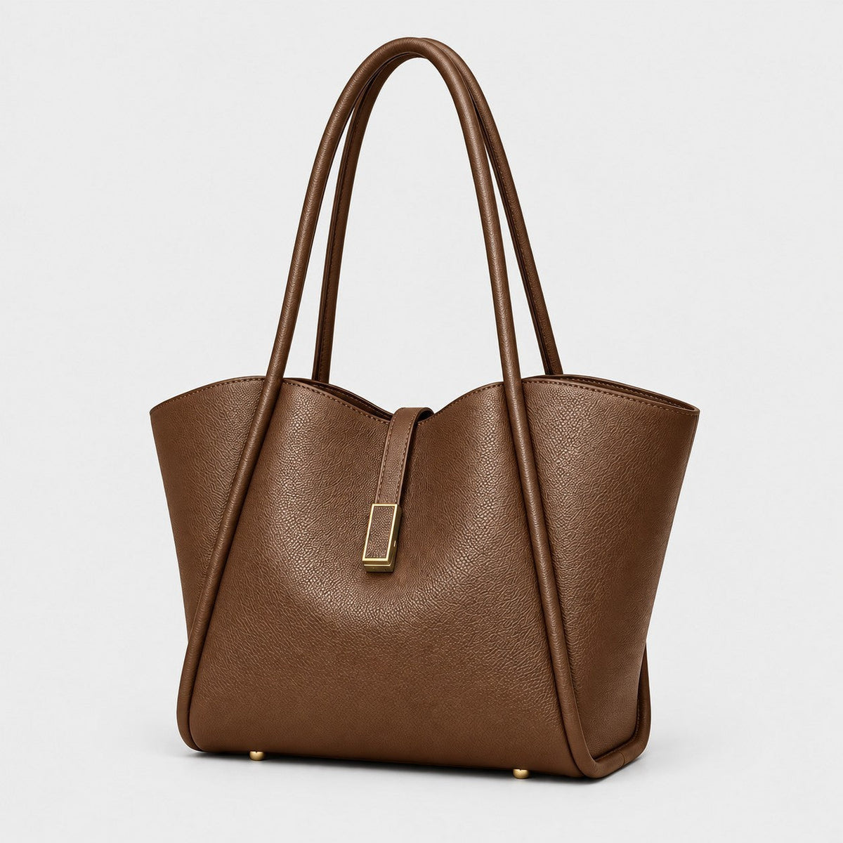 VALENORA Charlotte brown vegan leather tote bag with litchi-grain texture, curved top, and gold hardware tab.