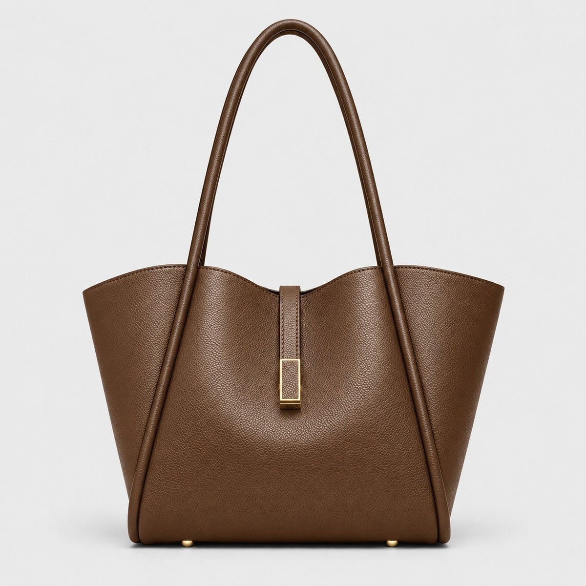 VALENORA Charlotte brown vegan leather tote bag with litchi-grain texture, curved top edge, and gold hardware tab.