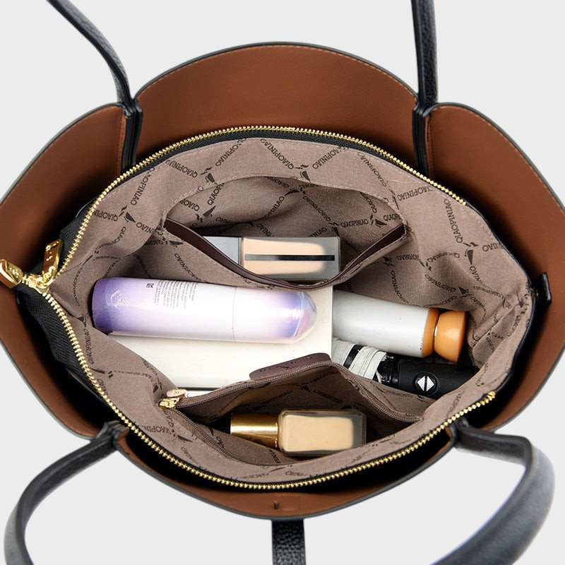 Interior view of VALENORA Charlotte tote bag showing organized pockets with cosmetics and daily essentials