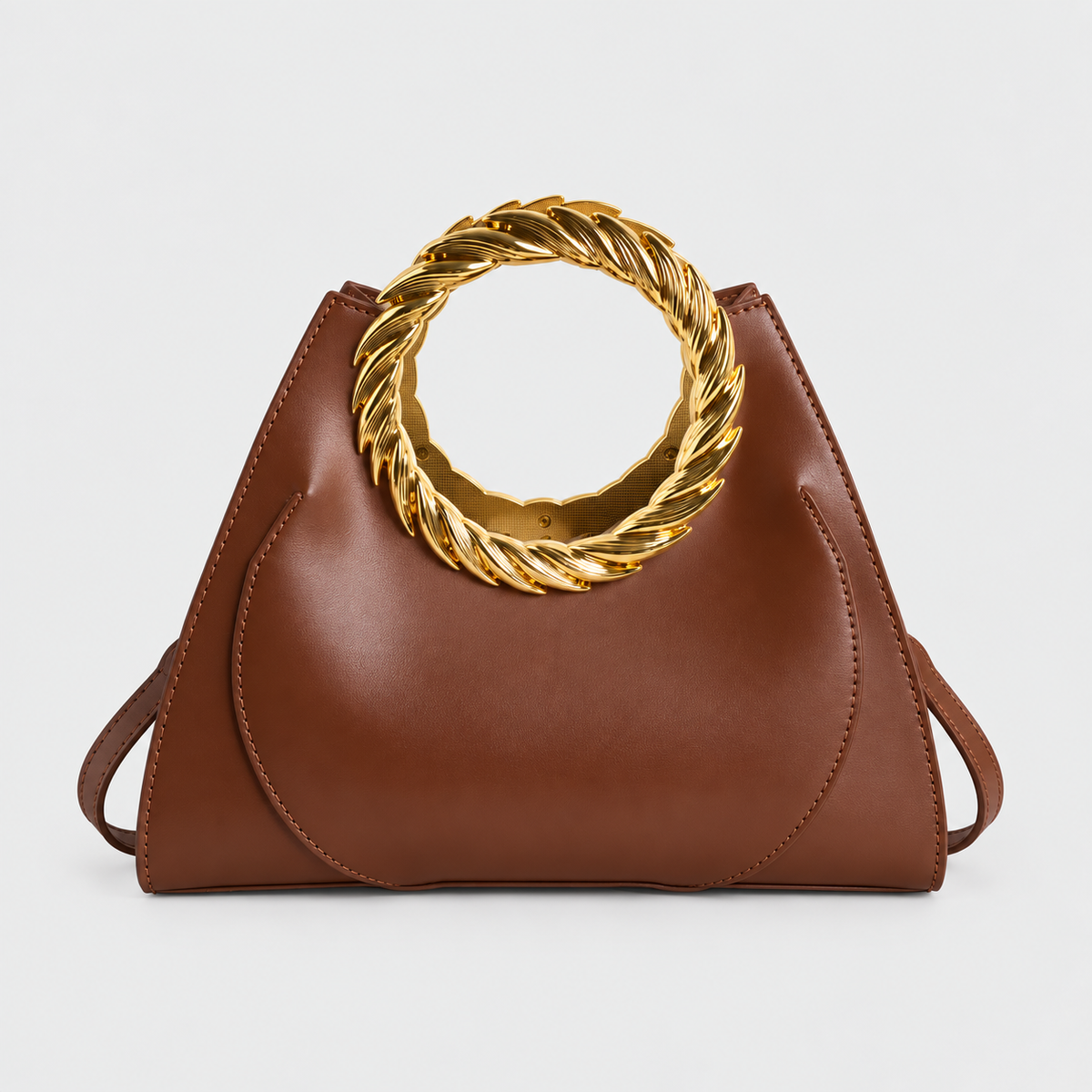 VALENORA Cleo brown vegan leather handbag featuring a bold, rope-twisted gold ring handle and tapered silhouette.