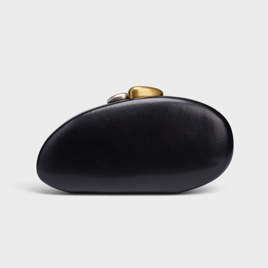 VALENORA Cosette black vegan leather clutch with a unique rounded pebble shape and two-tone gold and silver clasp.