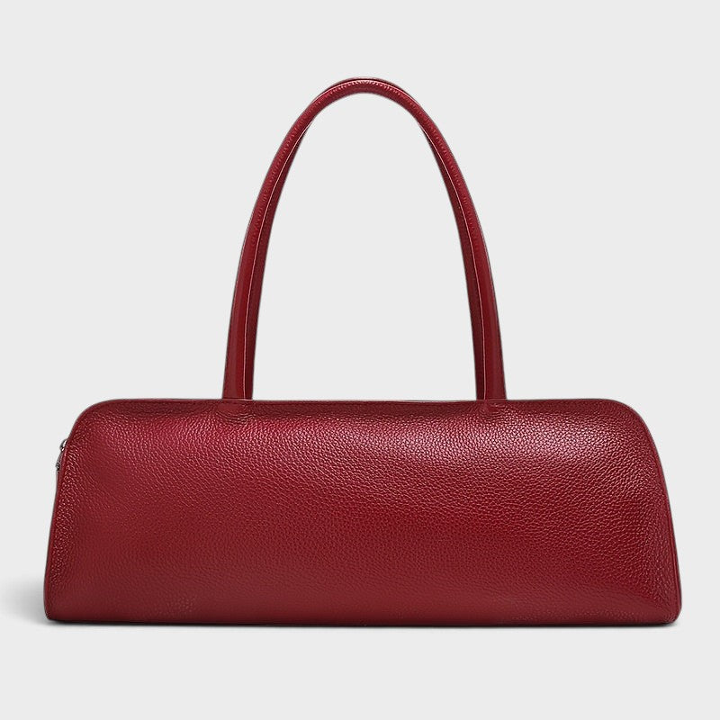 VALENORA Elsbeth handbag in burgundy genuine cowhide leather with a long cylindrical shape and fixed shoulder straps.