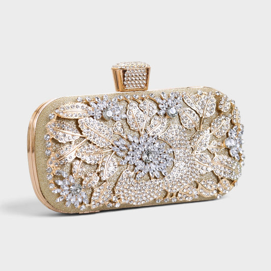 VALENORA gold European clutch bag featuring intricate floral crystal embellishments and a faceted clasp closure.