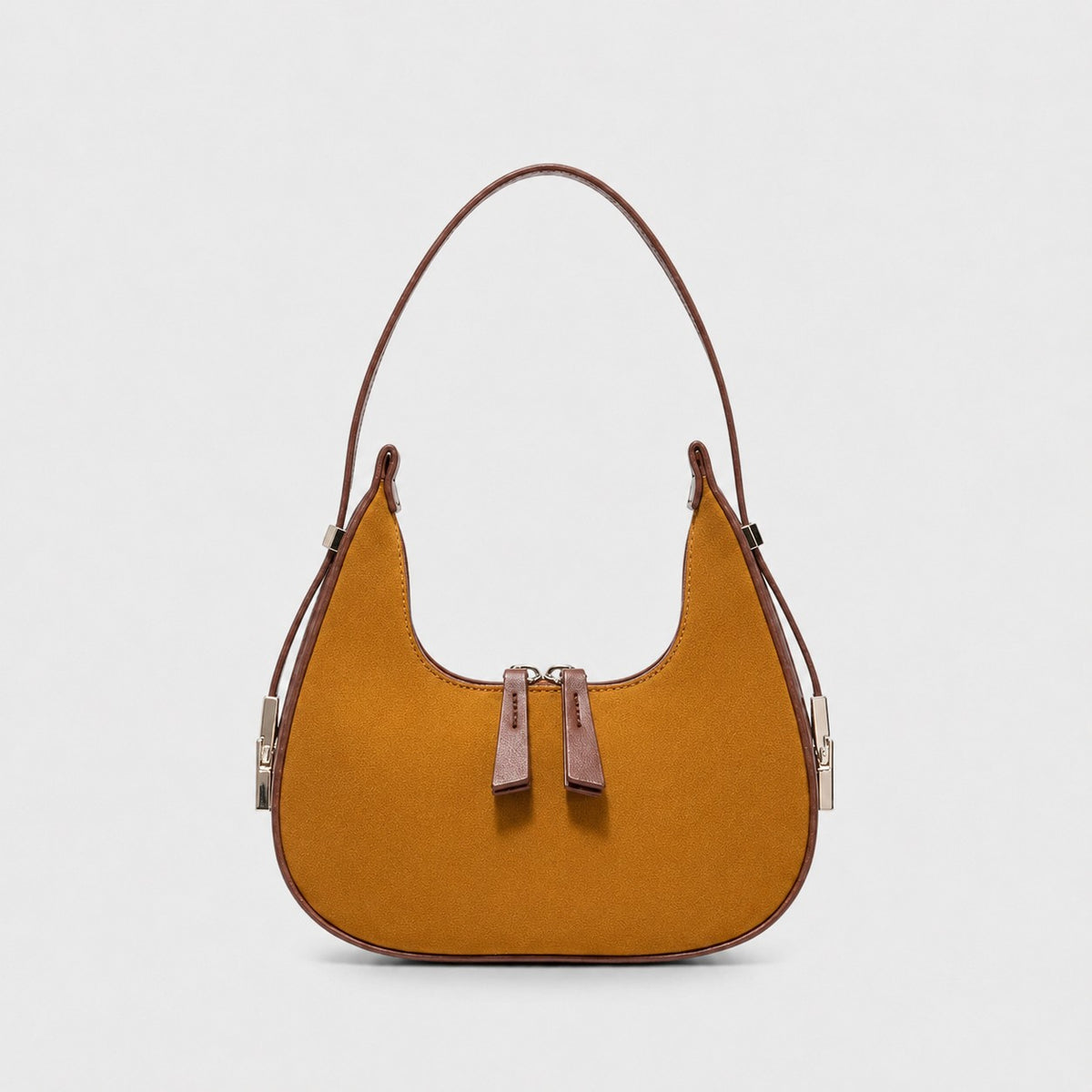 VALENORA French shoulder bag in brown suede with leather trim and a rounded silhouette on a light grey background.