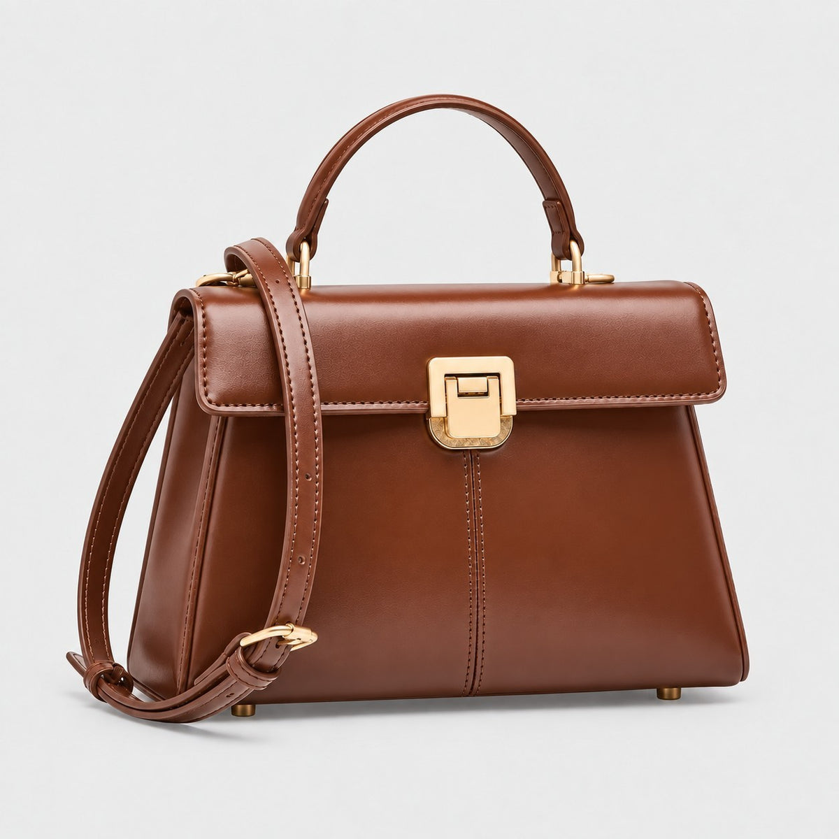 VALENORA Henna dark brown genuine leather crossbody handbag with a structured rectangular shape and gold hardware.
