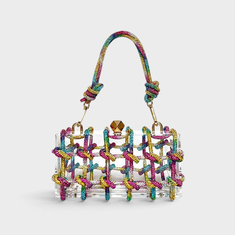 VALENORA Isabelle transparent acrylic clutch bag with a vibrant rainbow crystal-embellished knotted cage design