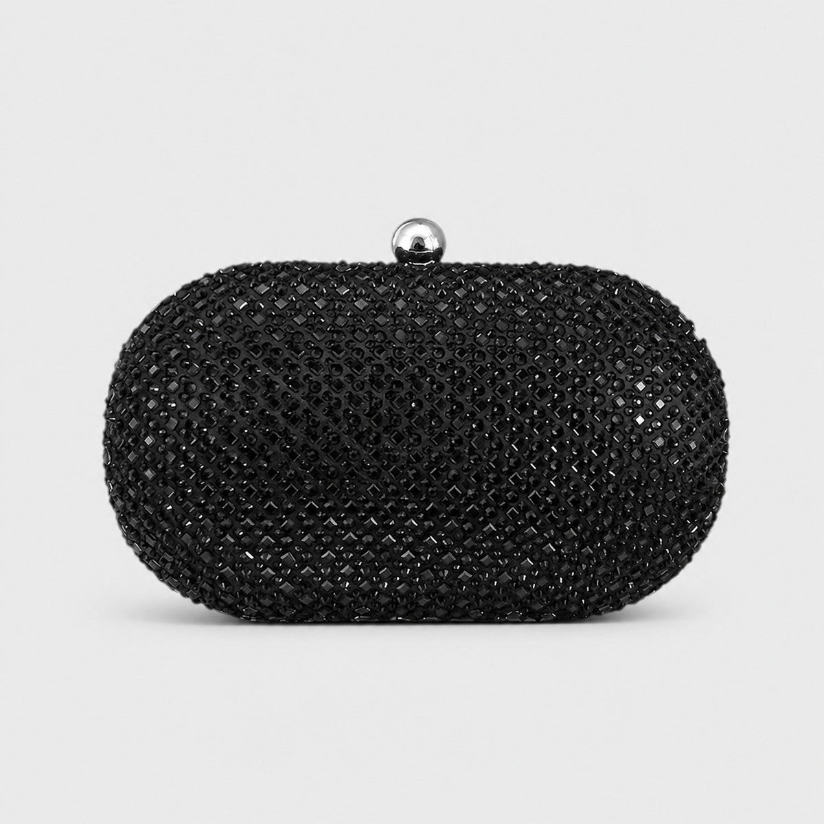 VALENORA Ismay oval clutch bag covered in black crystals with a polished silver ball clasp for evening wear.