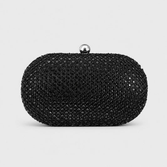 VALENORA Ismay oval clutch bag covered in black crystals with a polished silver ball clasp for evening wear.
