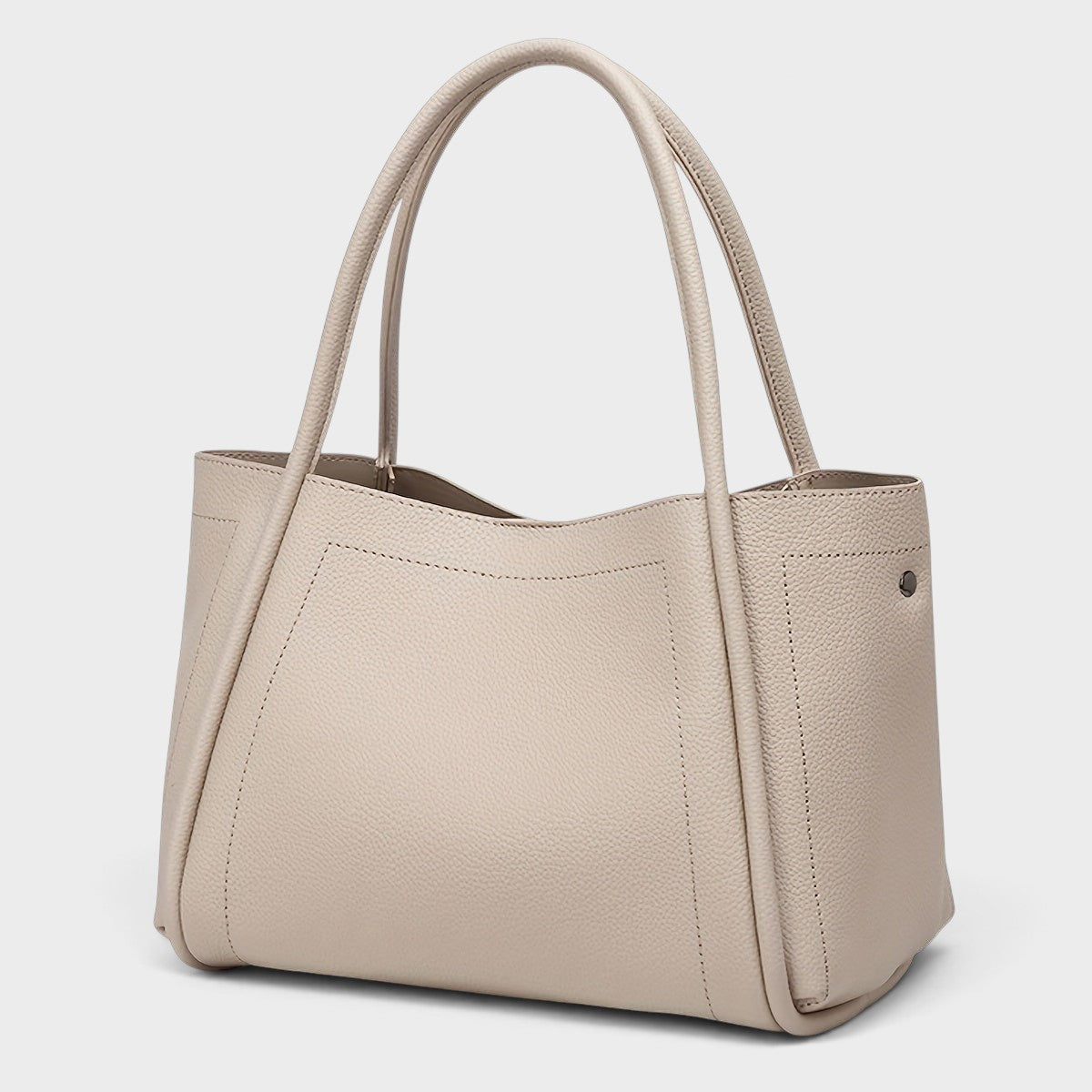 VALENORA Kate structured beige vegan leather tote bag with dual top handles and a smooth, minimalist design.