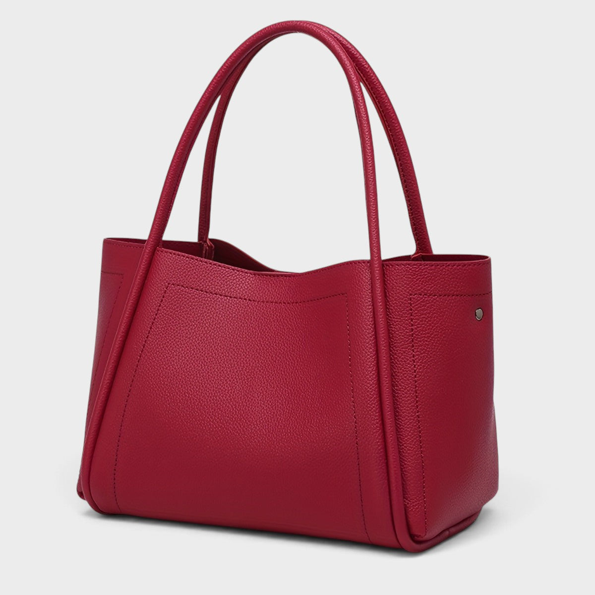 VALENORA Kate structured red vegan leather tote bag with dual top handles and a smooth, minimalist design.
