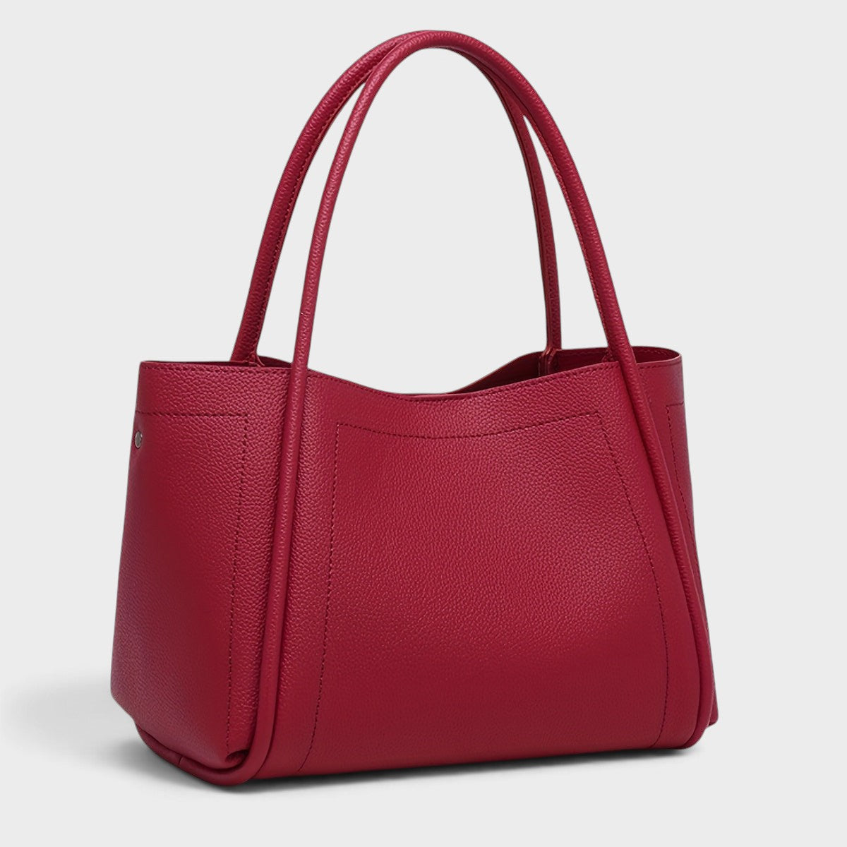 VALENORA Kate structured red vegan leather tote bag with dual top handles and a smooth, minimalist design.