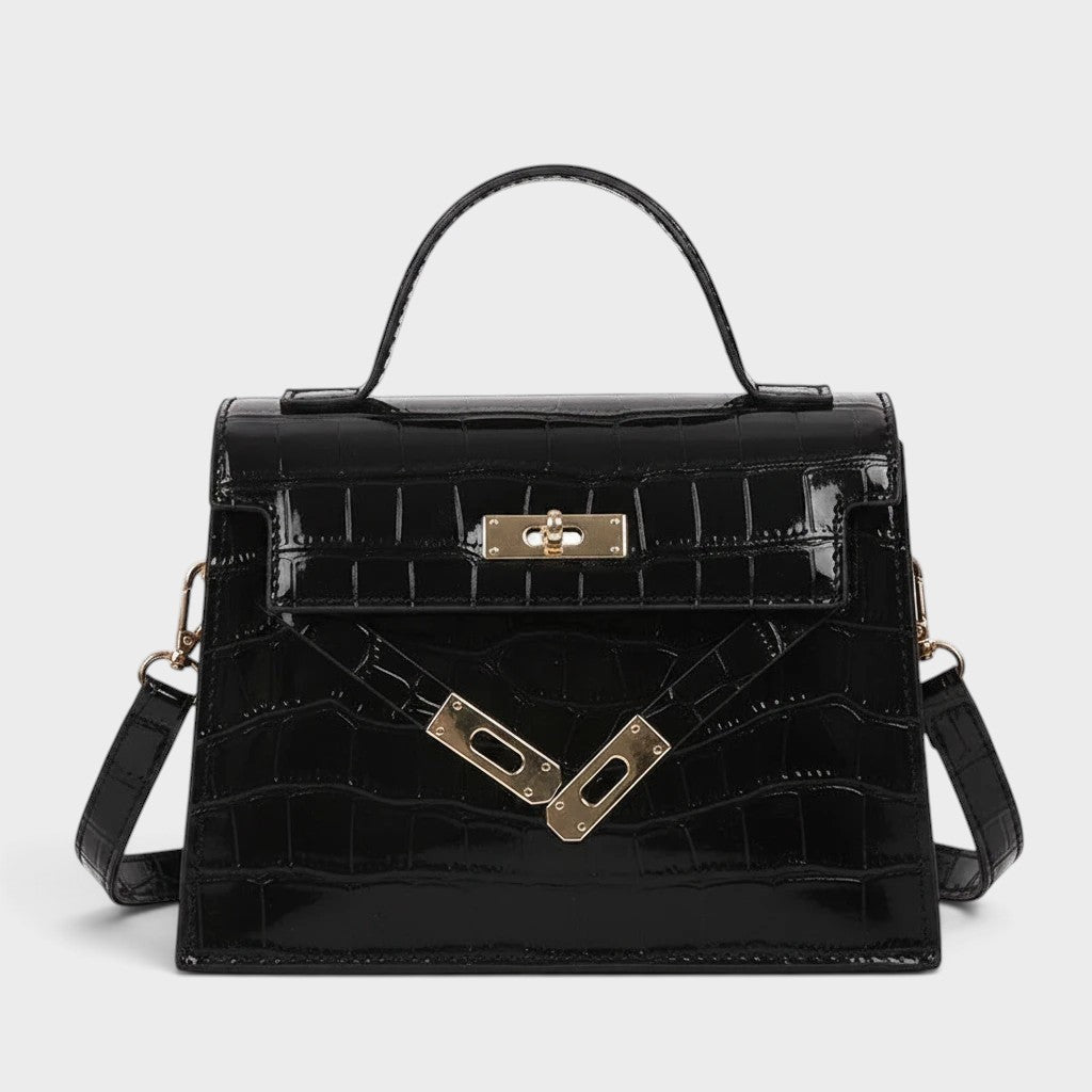 VALENORA Kelly black genuine leather crossbody handbag with a glossy crocodile-embossed finish and gold hardware.