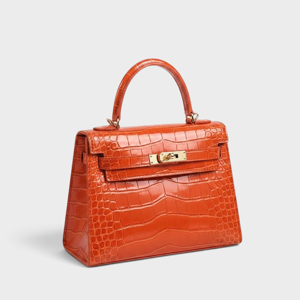 VALENORA Kelly orange genuine leather crossbody handbag with a crocodile-embossed texture and gold-tone hardware.