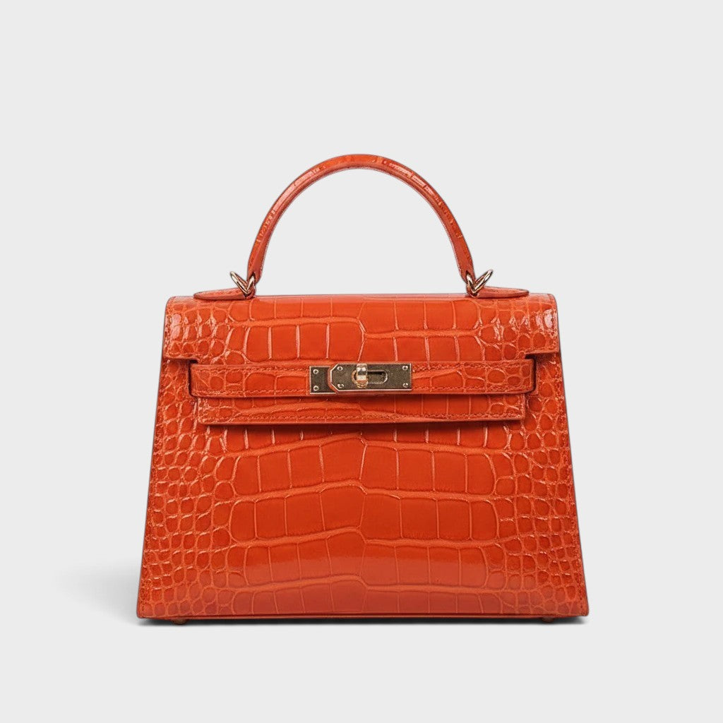 VALENORA Kelly orange genuine leather crossbody handbag with a crocodile-embossed texture and gold-tone hardware.