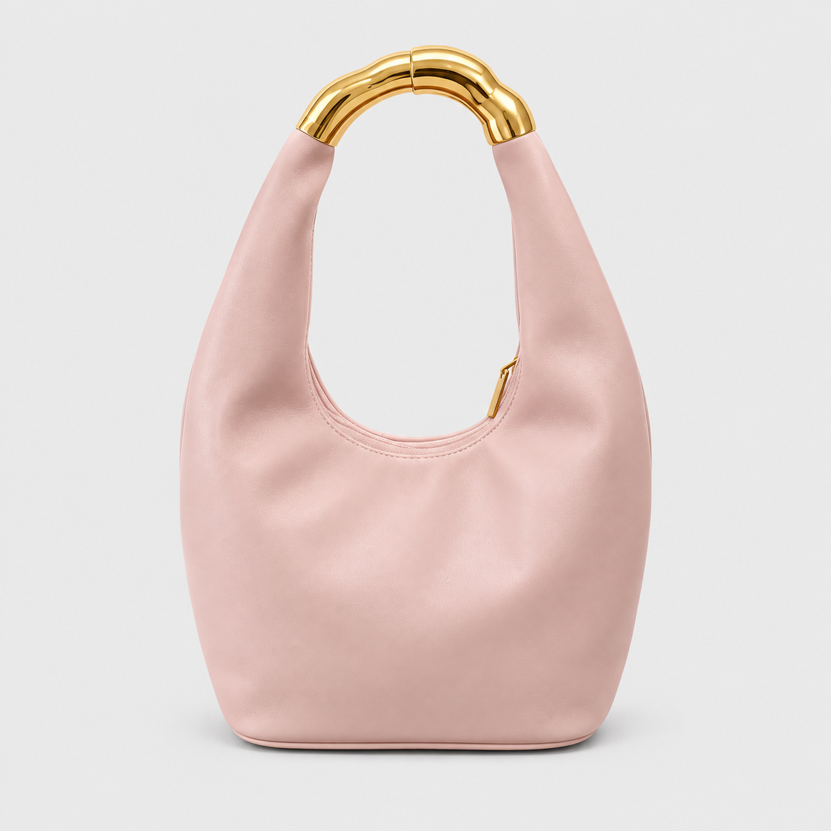 VALENORA Liana shoulder bag in pink vegan leather with a sculptural gold bamboo-textured ring handle.