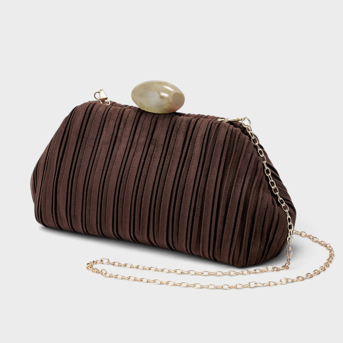 VALENORA Liora brown pleated suede clutch bag with a smooth oval stone clasp and a delicate gold chain strap.